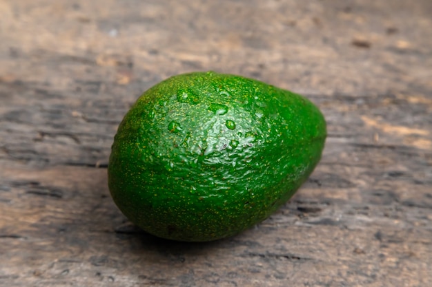 fresh avocado on dark wooden table