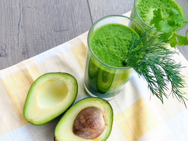 fresh avocado smoothie on gray 