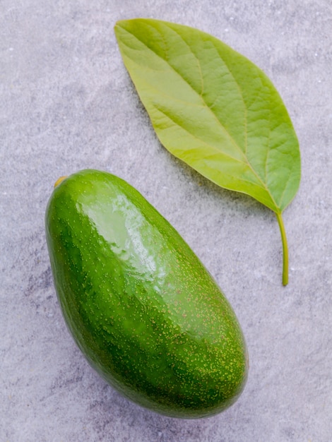 Fresh avocado on stone background. 