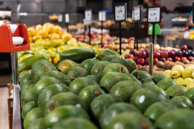 Fresh avocados in the supermarket Vegetables and fruits exposed for the consumer to choose