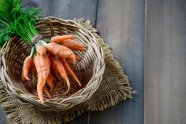 Fresh Baby carrots in bamboo basket healthy food