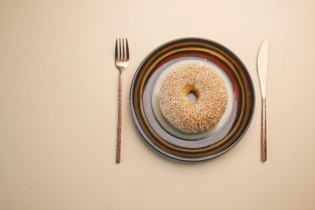 Fresh bagel bread on a plate on table