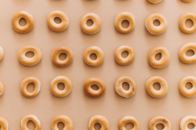 Fresh bagel on brown background