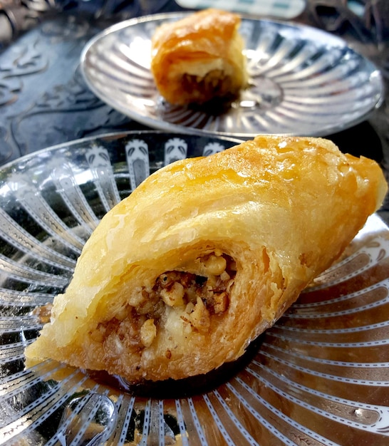 fresh baked baklava on a silver colored platesimage of a