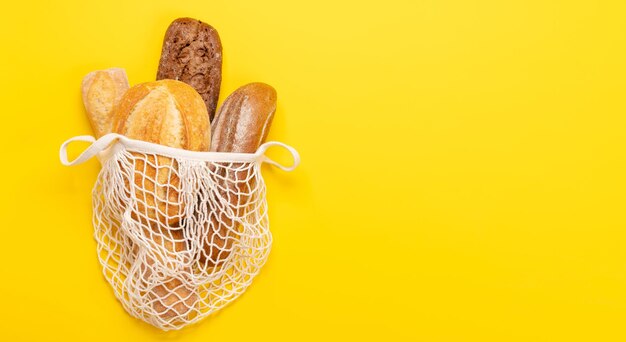 Fresh baked bread in mesh bag