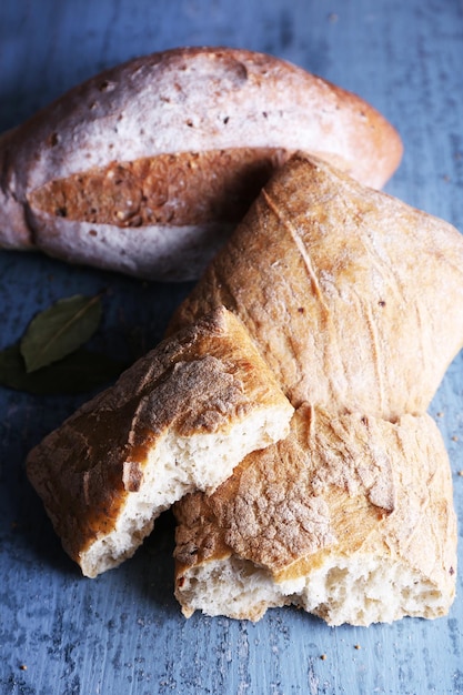 Fresh baked bread on wooden background