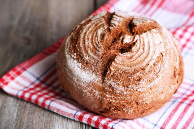 Fresh baked bread on wooden background