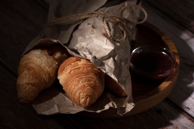 Fresh baked croissants lie on the table in the kitchen