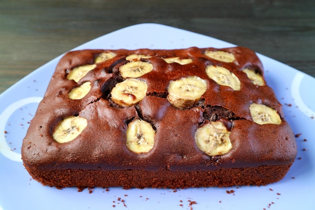 Fresh Baked Flavorful Homemade Wholemeal Chocolate Banana Cake on a Blue Plate