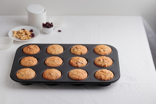 Fresh baked muffins in a baking pan