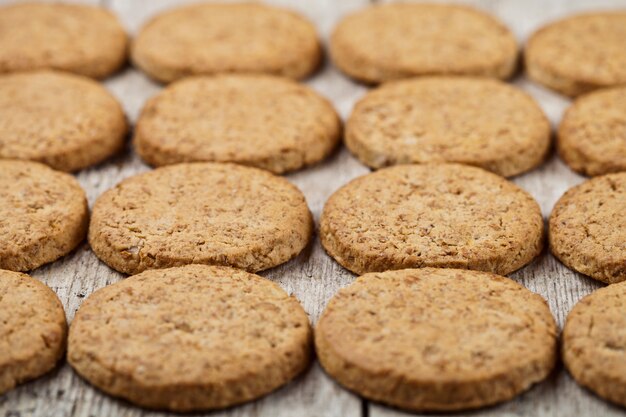 Fresh baked oat cookies closeup on rustic wooden table 