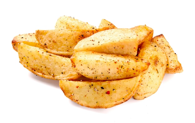 Fresh baked potato wedges with seasonings on a white background