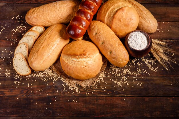 Fresh baked white bread on a brown concrete