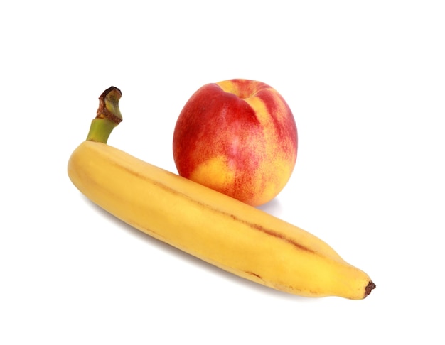 Fresh banana and peach isolated on a white background