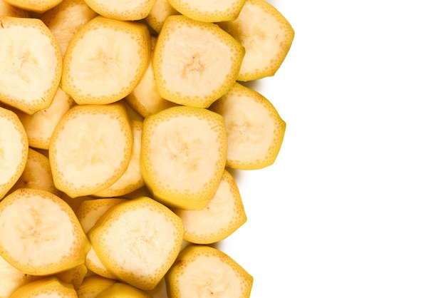 Fresh banana slices background. Top view.