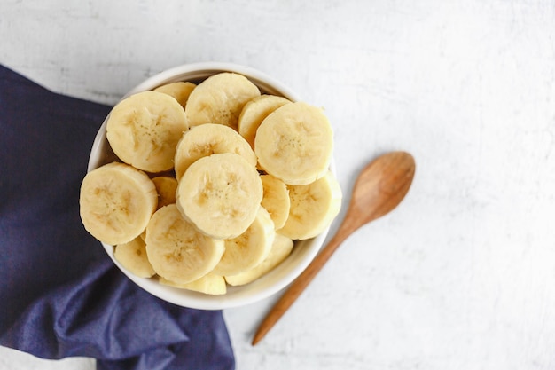 Fresh banana slices in a bowl