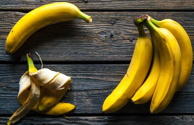 Fresh bananas on wooden background. Fruit, nature, food