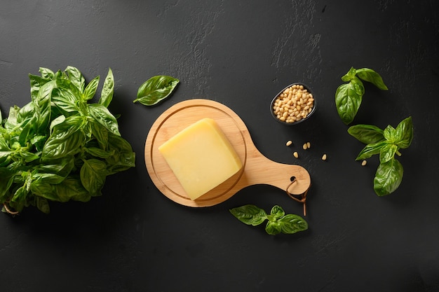 Fresh basil cedar nuts olive oil and parmesan and ingredients for homemade pesto