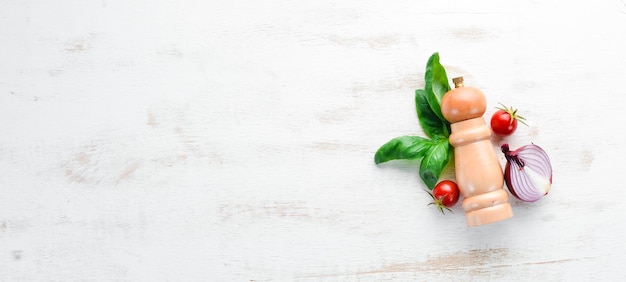 Fresh basil and spices On a white wooden background Top view Free copy space