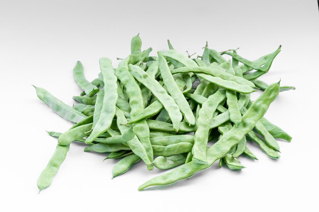 Fresh bean pods on white background