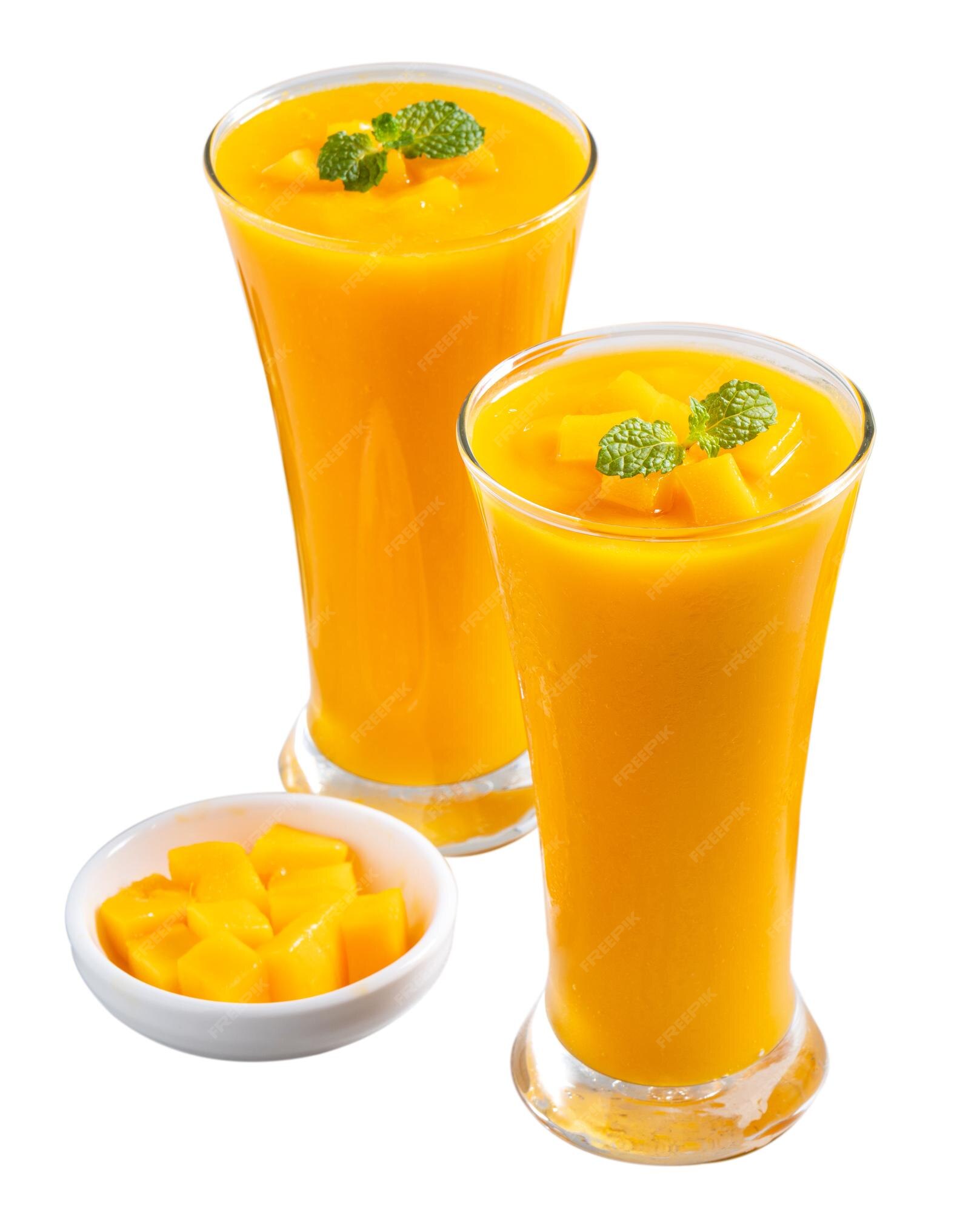 Premium Photo | Fresh beautiful delicious mango juice smoothie in glass cup  isolated on white background