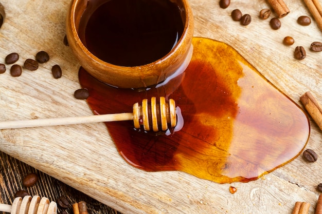 Fresh bee honey poured on a board