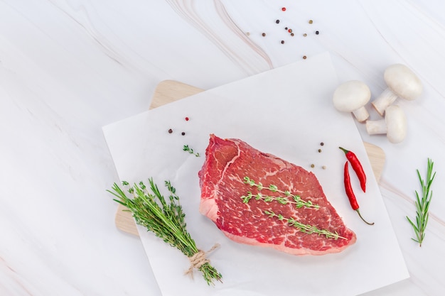 Fresh beef fillet with ingredients in cooking