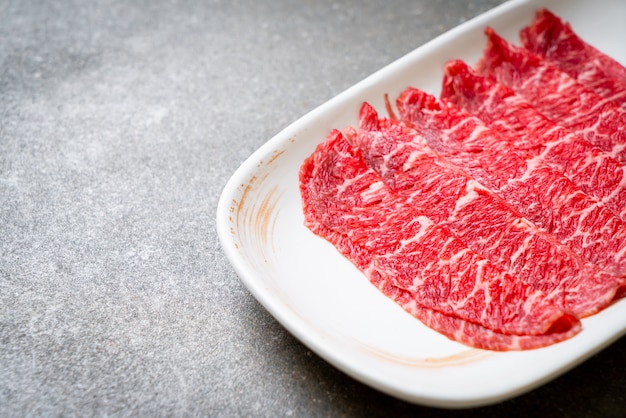 fresh beef raw sliced with marbled texture served for Sukiyaki and Shabu or Yakiniku