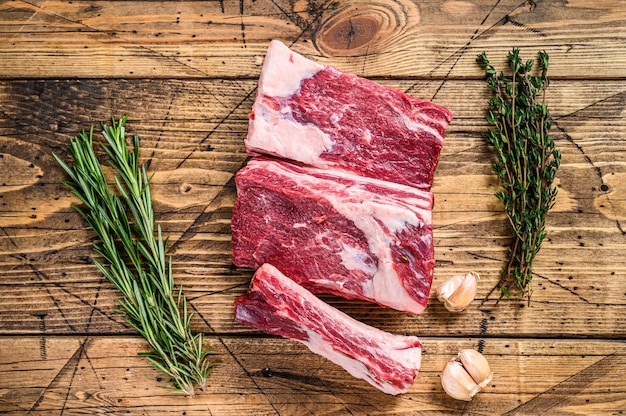 Fresh Beef short ribs on butcher wooden table