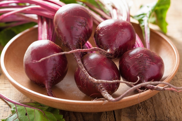 Fresh beet in wooden bowl