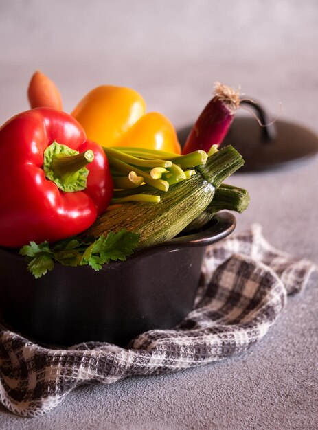 Fresh bell peppers and other vegetables ready for cooking