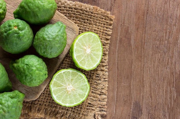 Fresh bergamot and bergamot slice on wooden