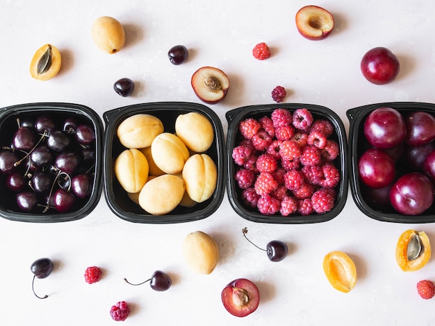 Fresh berries are packed in boxes.