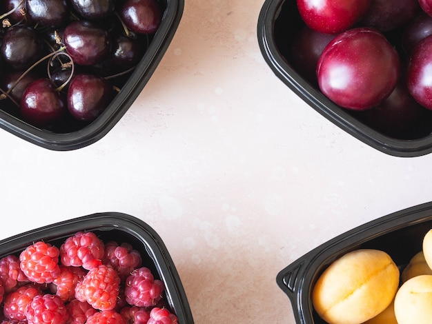 Fresh berries are packed in boxes.