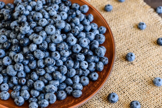 Fresh berries of blueberry on a plate. 