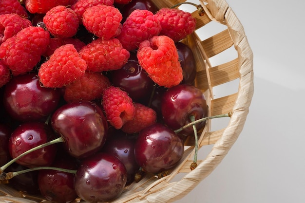 Fresh berries closeup in a wicker bucket