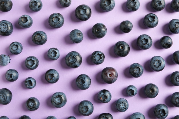 Fresh berries on color space, close up