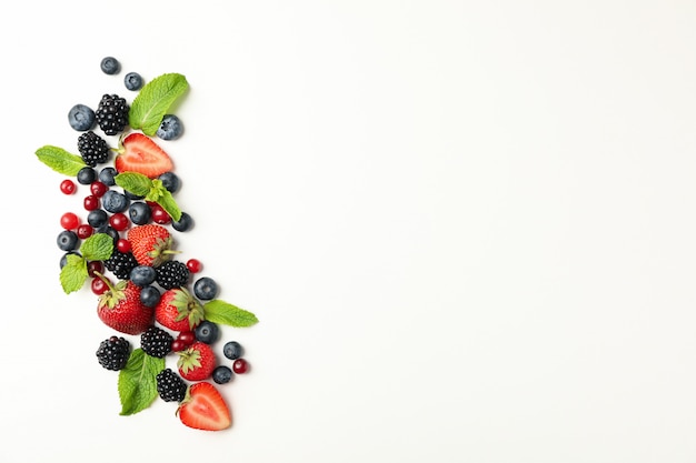 Fresh berries with mint leaves isolated