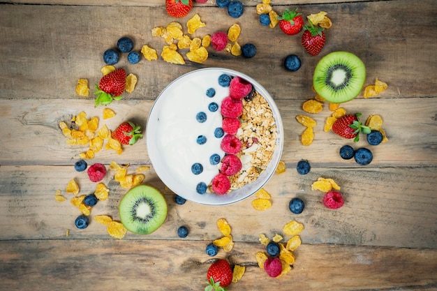 Fresh berries with yogurt and cornflakes in a bowl