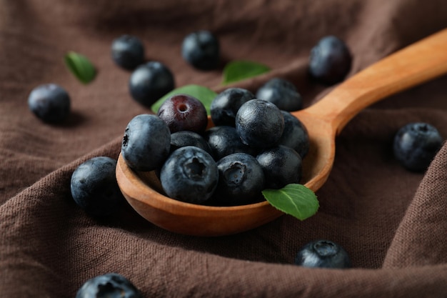 Fresh berry concept with blueberry on kitchen towel surface