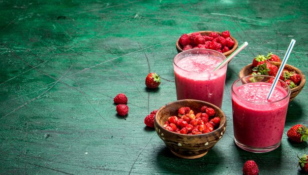 Fresh berry smoothie on rustic background
