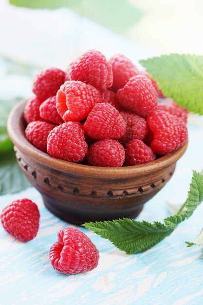 Fresh big juicy raspberry in a bowl