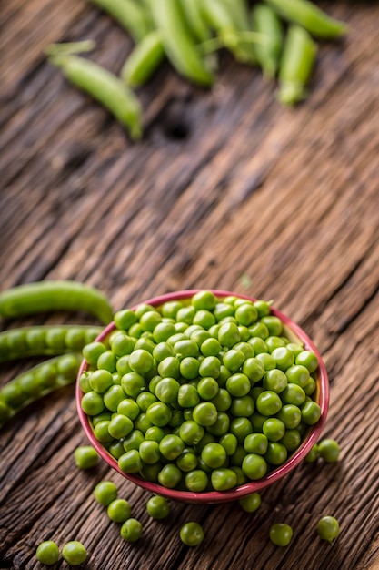 Fresh bio homemade peas and pods on old oak board Healthy fresh green vegetable  peas and pods