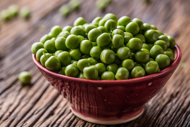 Fresh bio homemade peas and pods on old oak board Healthy fresh green vegetable  peas and pods