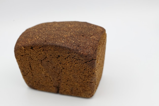 Fresh black bread on light background