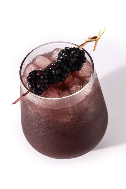 Fresh blackberry cocktail in cold glass isolated on white