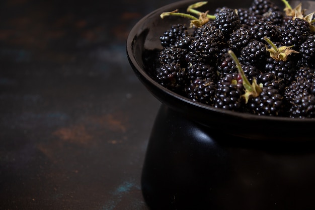 Fresh blackberry on a dark surface