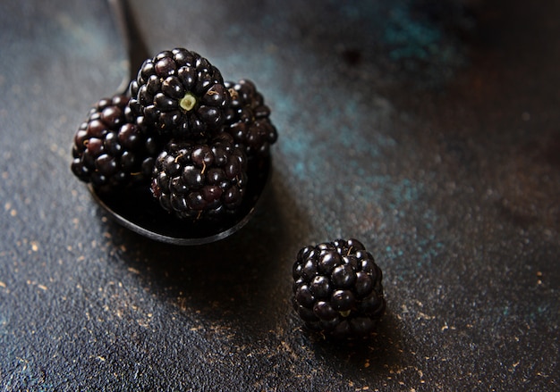 Fresh blackberry on a dark surface