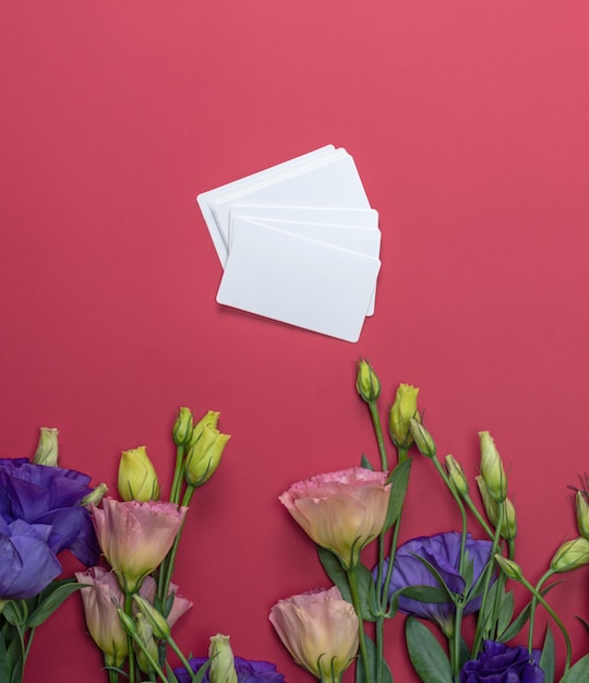 Fresh blooming flowers Eustoma Lisianthus and empty paper card 