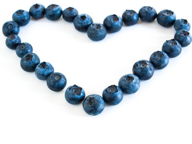 Fresh bluberries from local market on white background. Blueberries contain anthocyanins,  and various phytochemicals, which possibly have a role in reducing risks of some diseases.